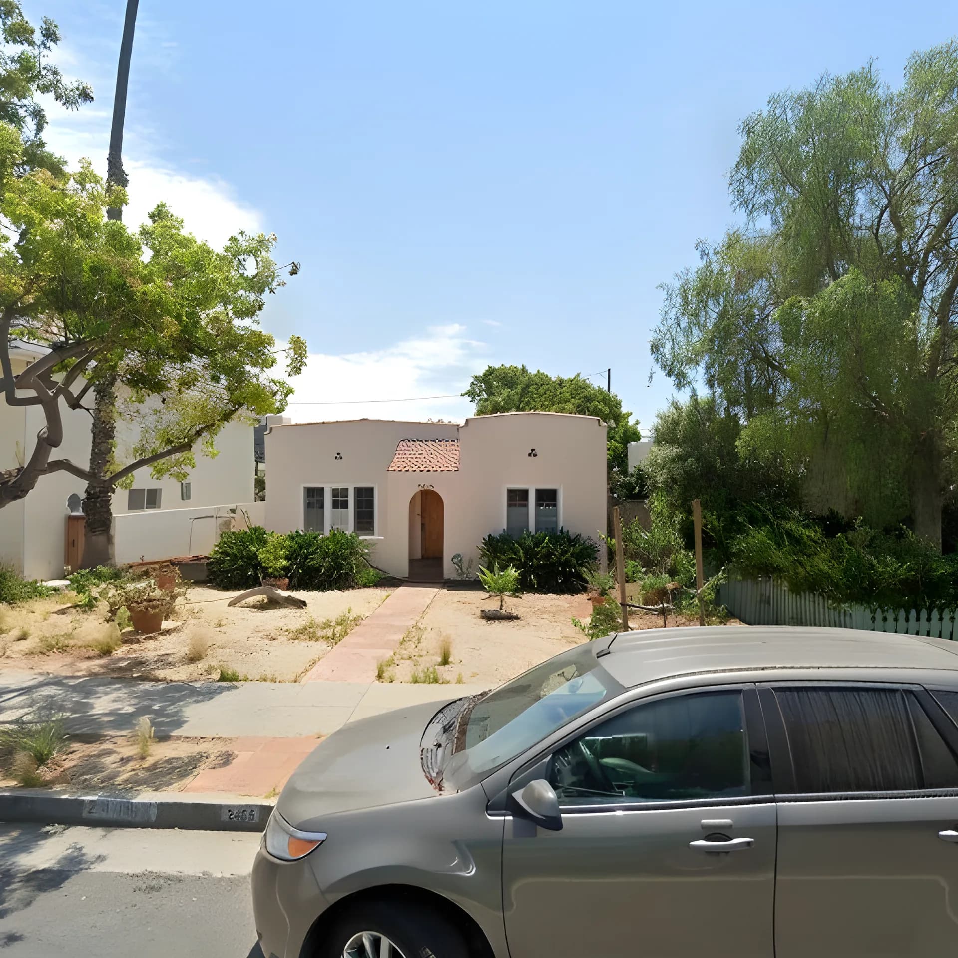 Original residential property street view before AI landscaping transformation